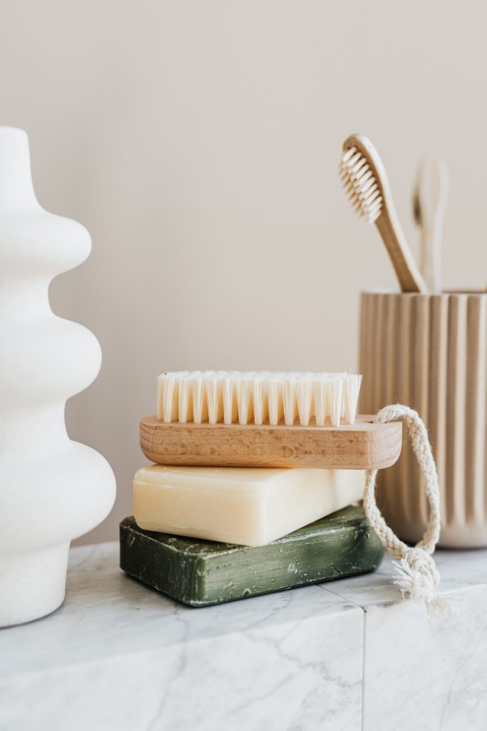 Sustainably produced products such as bar of soap, washing brush and toothbrush made of bamboo